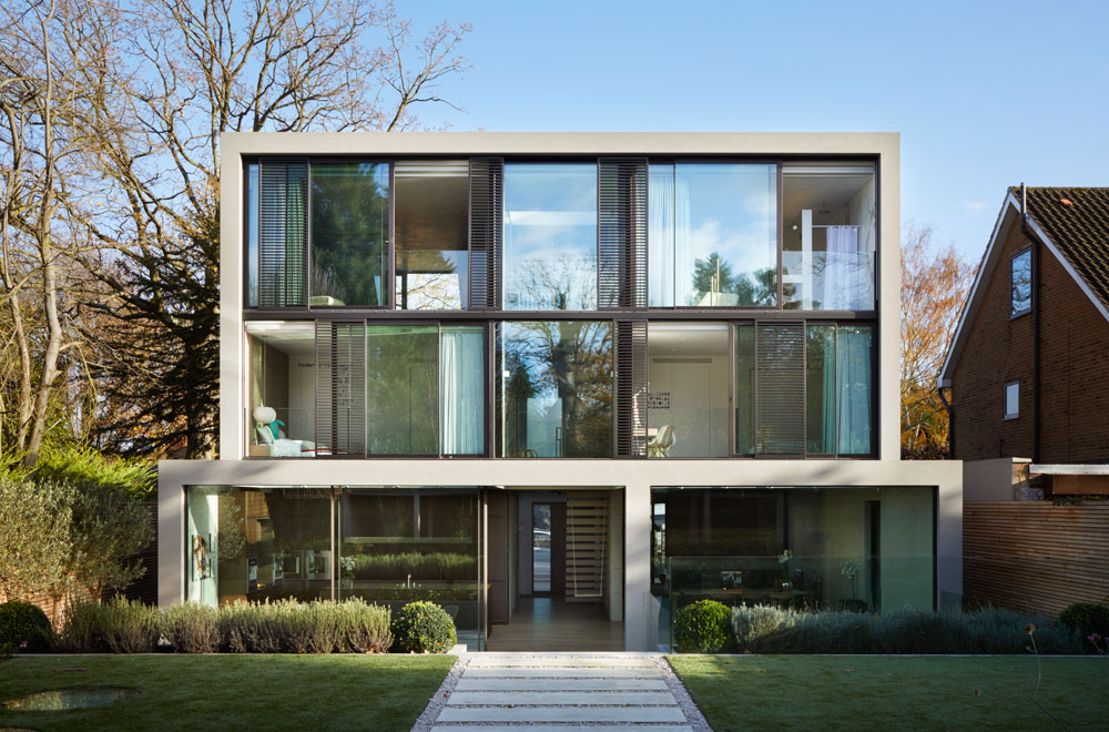 Kenwood Lee is a new family home in a conservation area. The house uses a subtle palette of materials; concrete twinned with brick, FSC timber, steel and glass. Internal spaces are anchored around a board-marked concrete core, which forms a triple-height atrium.