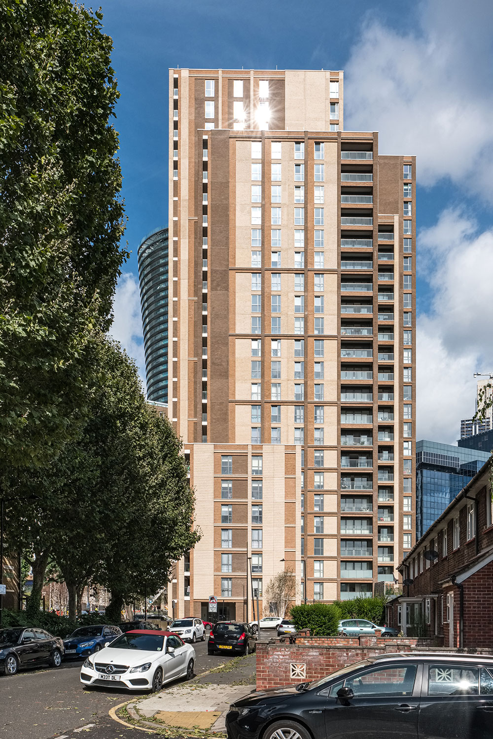 The Liberty Building is a new 26-storey building which provides 155 homes next to the Crossharbour DLR station in the Isle of Dogs. Four vertical elements run with the area’s urban grain; taller on the western side facing Canary Wharf, lower on the east where it abuts a lower-rise residential zone, helping create a transition between these areas. The use of brick responds to the 19th-century warehouses and the terraced houses on either side. We were responsible for the full mechanical and electrical design including the detailing of the communal heating system, water distribution system and a new substation and energy centre.