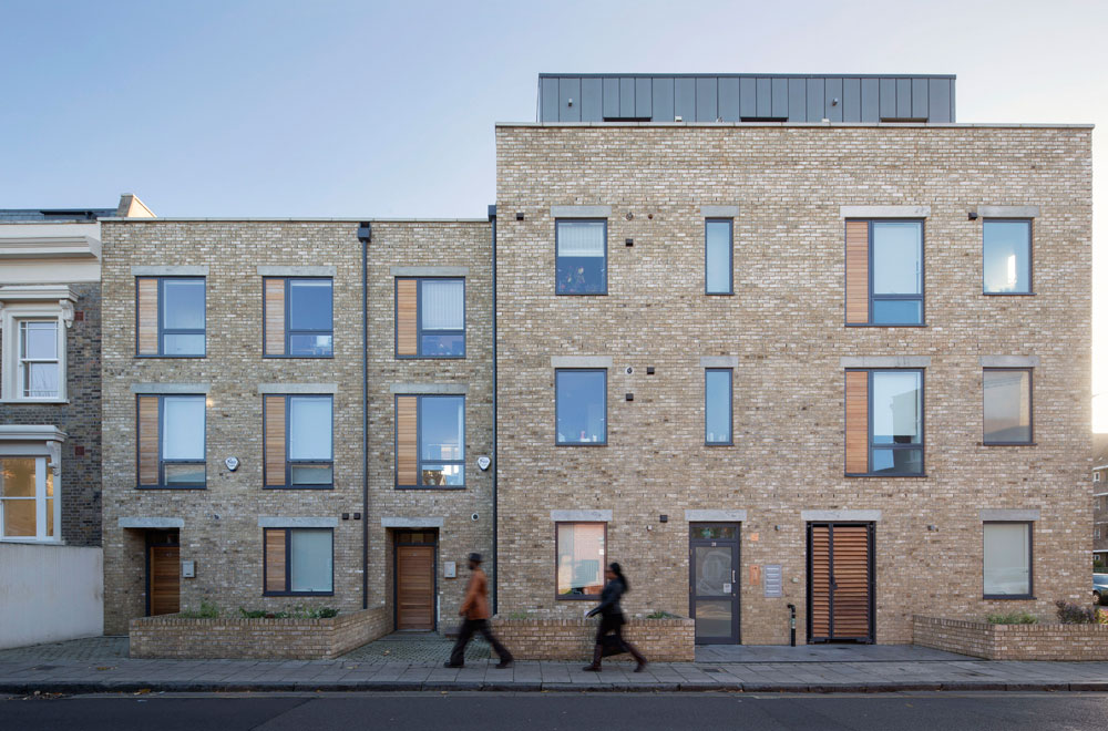 The new-build residential development is built on an empty corner site on Marmont Road, adjacent to two Victorian terraces. The project comprises of eight residential units, including one duplex unit. The height and facade provide a suitably robust form to this prominent corner site, whilst remaining harmonious to the scale of the neighbouring buildings. A simple palette of brick, timber, zinc cladding and stone provide a sympathetic contemporary response to the surrounding context.