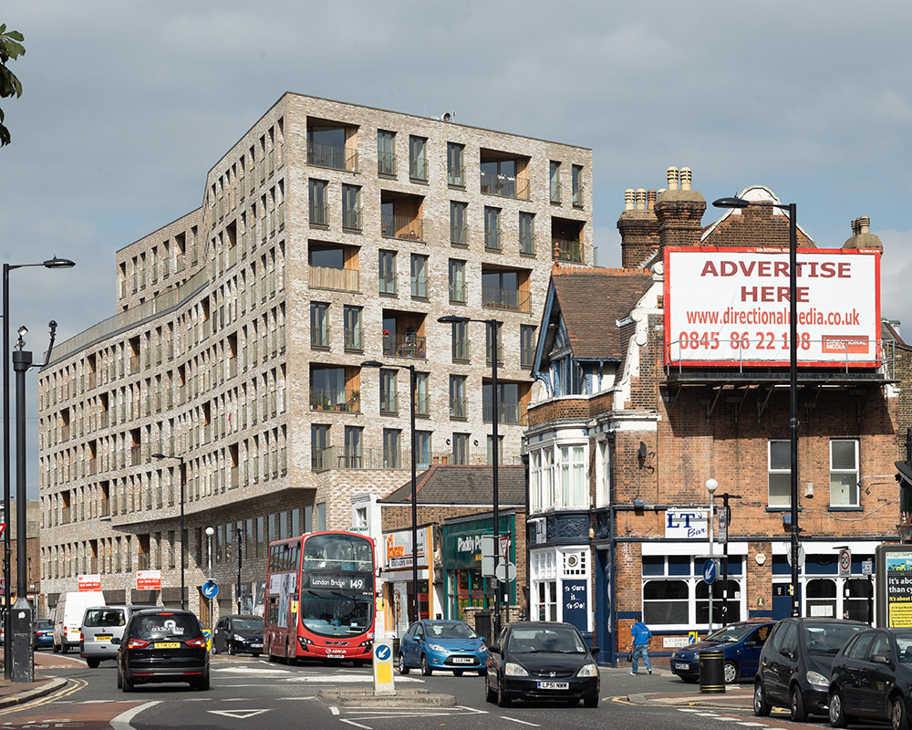 Prowse Court and Lord Graham Mews interfaces with both a town centre high street and streets of modest terrace houses. The redevelopment reinforces the high street by replacing the existing shops with new, better serviced units, and by aligning the residential block along the street edge. The orientation of the 118 residential block optimises the available solar gain and improves daylighting for tenants. To the rear, 22 new energy efficient Code 4 houses complete the suburban Victorian fabric. The scheme also features a health centre and new community facilities. We provided all mechanical and electrical services, using BIM for coordination of design and subsequent delivery.