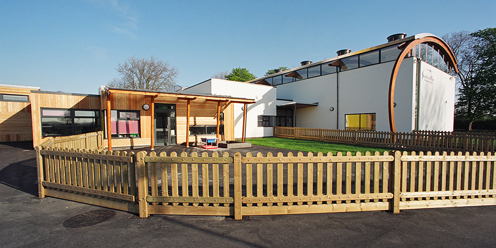 Wherever possible, the building is naturally ventilated, with the classroom modules naturally ventilated with automated low-level damper openings and high-level actuator driven windows, controlled by carbon dioxide sensors. The openings are controlled by the building management system (BMS) to provide cooling of the classrooms during night-time. The BMS provides control of boilers, hot water system, space heating, ventilation system, monitoring and alarm generation and pulse counting from utility meters. Utility data is then transferred to software-based energy analysis packages for monitoring consumption cost and energy management for the building.