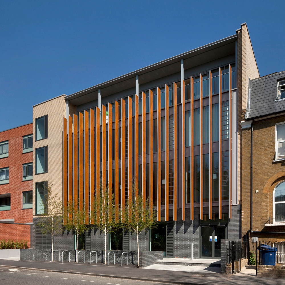 Well Street Surgery is a refurbishment and extension of a four-storey, steel framed textile factory. The existing building at the rear of the site houses the principal clinical accommodation and the new extension contains waiting areas, circulation spaces and reception area. The facilities include consulting rooms for 15 GPs, a minor surgery clinic, an office for the district primary care service, community kitchen, seminar rooms, a library and staff lounge with sun terrace.